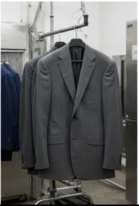 Grey Suit being dry cleaned